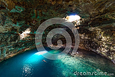 Cenote Samula Dzitnup near Valladolid, Yucatan, Mexico - swimming in crystal blue water Editorial Stock Photo