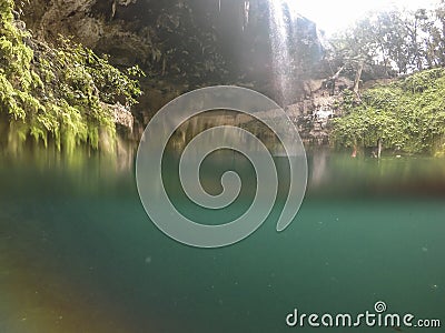 Cenote Zaci - Valladolid, Mexico: is a natural sinkhole, resulting from the collapse of limestone bedrock that exposes groundwater Editorial Stock Photo
