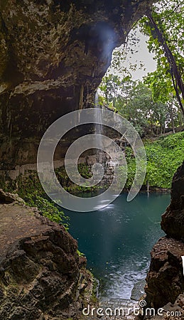 Cenote Zaci - Valladolid, Mexico: is a natural sinkhole, resulting from the collapse of limestone bedrock that exposes groundwater Editorial Stock Photo