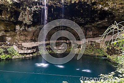 Cenote Zaci - Valladolid, Mexico: is a natural sinkhole, resulting from the collapse of limestone bedrock that exposes groundwater Editorial Stock Photo