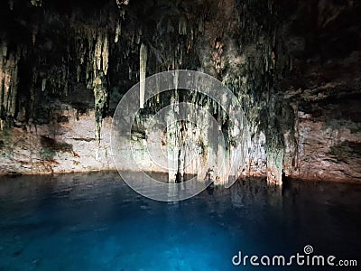 The Cenotes in Yucatan, Mexico with sedimentary rocks that infiltrate rainwater and form large caverns or water reservoirs Stock Photo