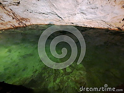 The Cenotes in Yucatan, Mexico with sedimentary rocks that infiltrate rainwater and form large caverns or water reservoirs Stock Photo