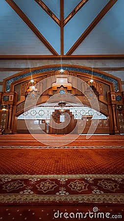 the center of the mosque or called the pulpit where the imam leads prayers or preaches with beautiful carpet colors Stock Photo