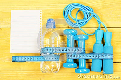 Centimeter tied around sports tools and water bottle Stock Photo