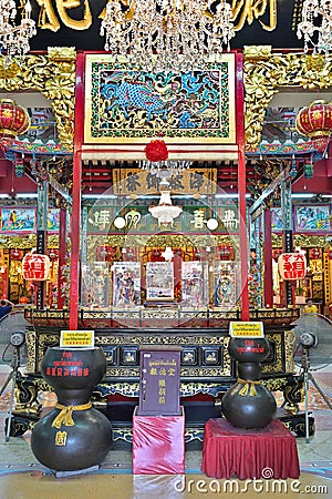 Central courtyard at the Tai Hong Kong shrine hall, with images of the Laughing Buddha and Four Heavenly Kings, Chinatown, Bangkok Editorial Stock Photo