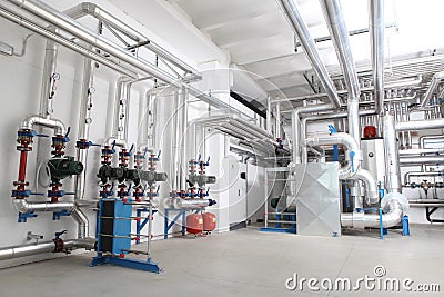 Central heating and cooling system control in a boiler room Stock Photo