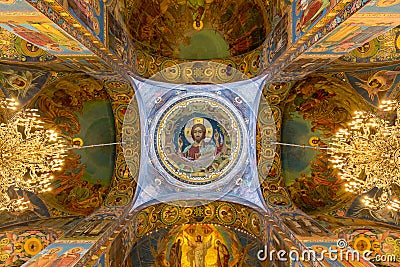 The Central mosaic image of Christ the Almighty in the ceiling of the Central dome of the Temple of the Savior on spilled Blood. Editorial Stock Photo