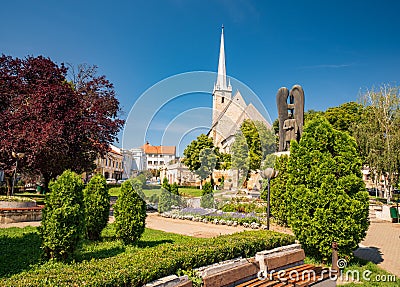 Central square of Dej city, Cluj County, Transylvania, Romania. Gothic Reformed-Calvin Church on background Stock Photo