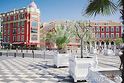 Nice, Provance, Alpes, Cote d`Azur, French July 31, 2018; Square Massena with red building and alley of potted trees. Editorial Stock Photo