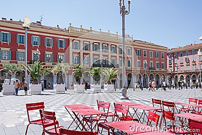 Nice, Provance, Alpes, Cote d`Azur, French July 31, 2018; View of the Place Massena square in Nice with red tables in foreground. Editorial Stock Photo