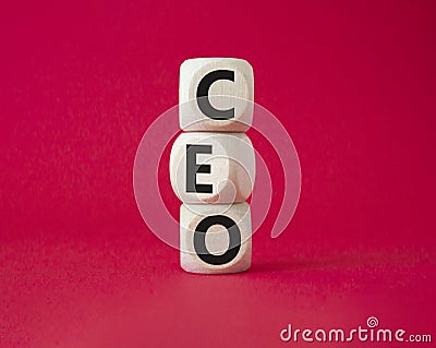 CEO - hief executive officer symbol. Concept word CEO on wooden cubes. Beautiful red background. Business and CEO concept. Copy Stock Photo