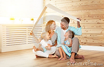 Cept housing a young family. mother father and children in new Stock Photo