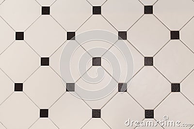 Ceramic beige octagon with tessellation black tiles background Stock Photo