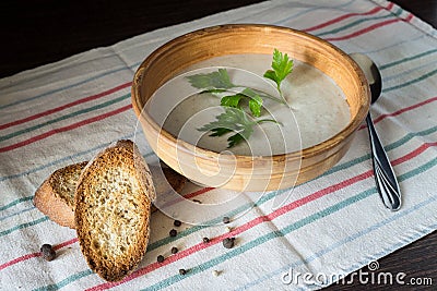 Ceramic bowl with mushroom soup puree with bread Stock Photo