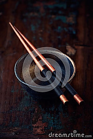 Ceramic bowl and wooden chopsticks Stock Photo