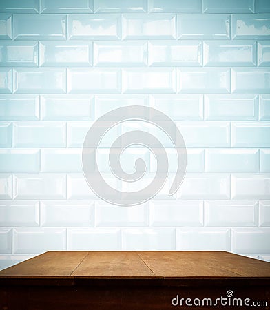 Ceramic brick tile wall and wooden table Stock Photo