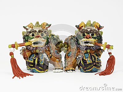 Ceramic Chinese Lions with Swords Stock Photo