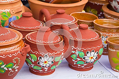 Ceramic clay handmade and handpainted decorative twin pots double pots with a handle and cover lids, jugs with floral and abstra Stock Photo