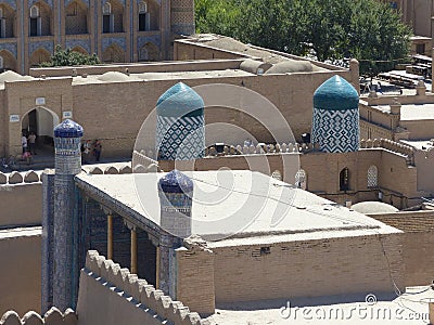 Ceramic decorated towers of a madrasah of Khiva in Uzbekistan. Editorial Stock Photo