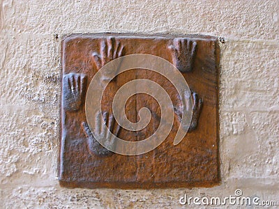 Ceramic hands on the walls of the Mehrangarh Fort in the blue city of Jodhpur, India Editorial Stock Photo