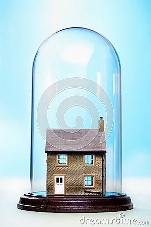 Ceramic house under glass cover Stock Photo