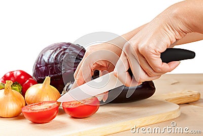 Ceramic knife with vegetables Stock Photo