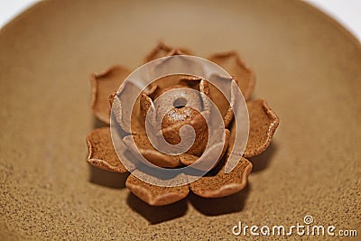 Ceramic rose on ceramical plate. Stock Photo