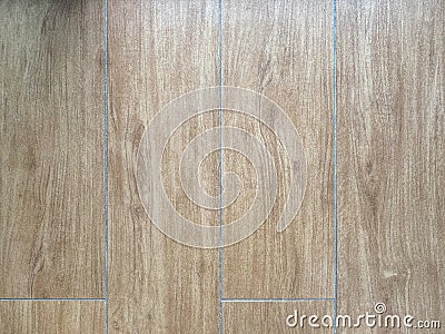 Ceramic tile with a pattern under the parquet Stock Photo