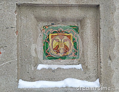 Ceramic tile with Russian heraldic symbol of two headed eagle Editorial Stock Photo