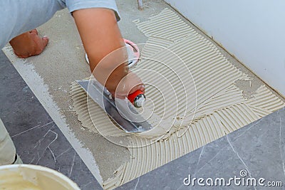 Ceramic tiles and tools for tiler. Floor tiles installation. Home improvement, renovation Stock Photo