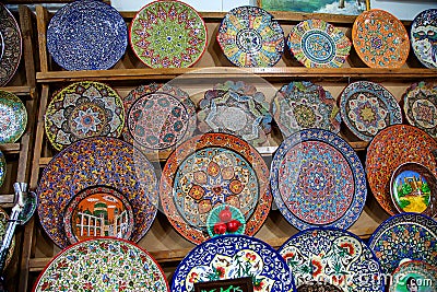 Ceramic Uzbek souvenir painted plates, rune-work at the Chorsu bazaar in Tanshkent. Traditional art. April 29, 2019 Editorial Stock Photo