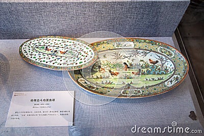 A ceramic work of art during the reign of Emperor Guangxu in the Qing Dynasty, painted with plates of roosters fighting Editorial Stock Photo