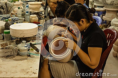 Vietnam action: Ceramics painting in Bat Trang, Viet Nam Editorial Stock Photo