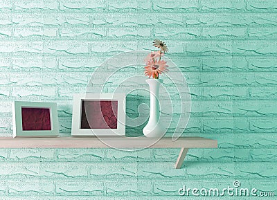 Ceramics vase with flower and frames on the shelf Stock Photo