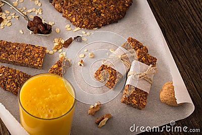 Cereal bars with raisins, nuts and orange juice. Stock Photo