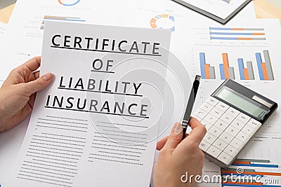 Certificat of liability insurance concept, documents on the desktop Stock Photo