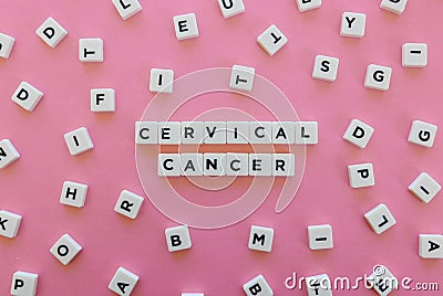 Cervical cancer word made of square letter word on pink background. Stock Photo