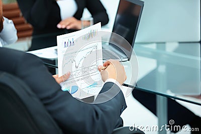 CFO looks at a graph of the financial condition of the company Stock Photo