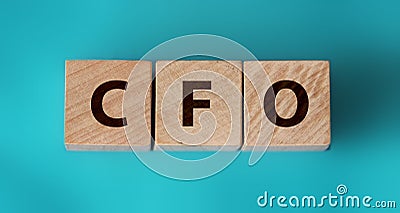 CFO text on wooden cubes. Chief Financial Officer on table background. Financial, marketing and business leader concept Stock Photo