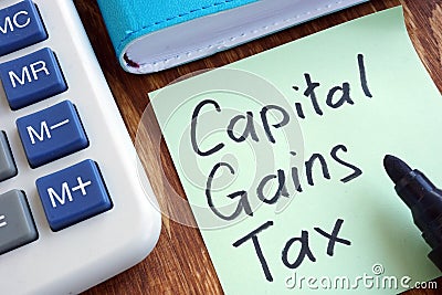 CGT Capital Gains Tax. Memo stick and calculator. Stock Photo