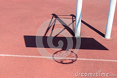 Chadow of basketball hoop at the red playground Stock Photo