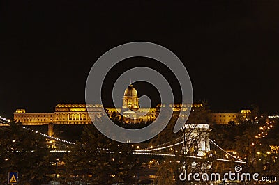 Chain Bridge and the Buda Castle in the Background at Night Stock Photo