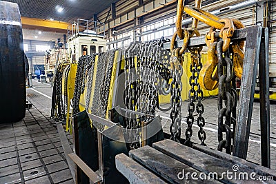 Chain for the crane on the rack, cargo slings for lifting goods Stock Photo