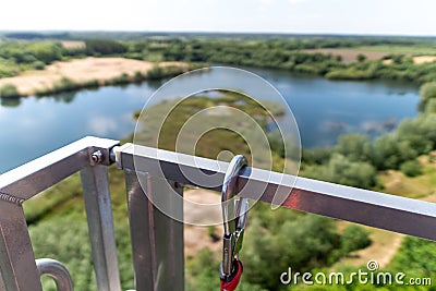 Chain fastening on a metal handrail on top of a building Stock Photo