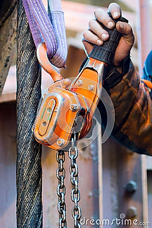 Chain hoist with hand Stock Photo