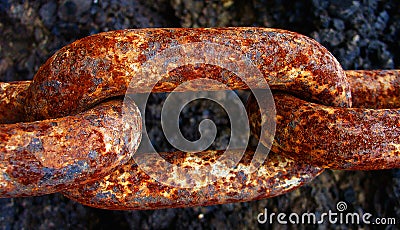 A chain linking a boat with the harbour in Jersey Stock Photo