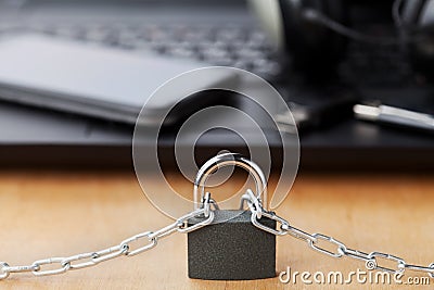 Chain with lock in front of the laptop and smartphone, gadget and digital devices detox concept Stock Photo