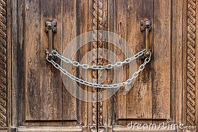 Chain locks ancient wooden door Stock Photo