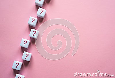 A chain of question marks on blocks. Questions and problem solving. Frequently asked Questions FAQ. Health and reproduction. Stock Photo