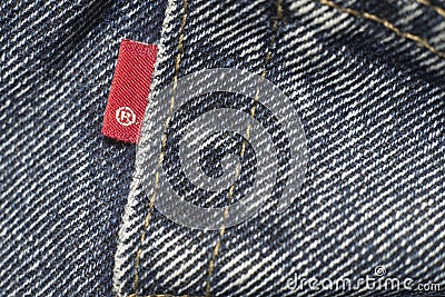 Closeup detail of levi`s red tag on levi `s jeans. Editorial Stock Photo